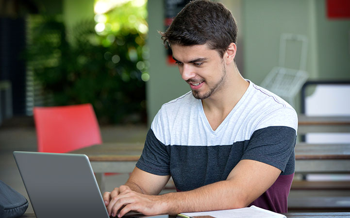 student utilizing laptop